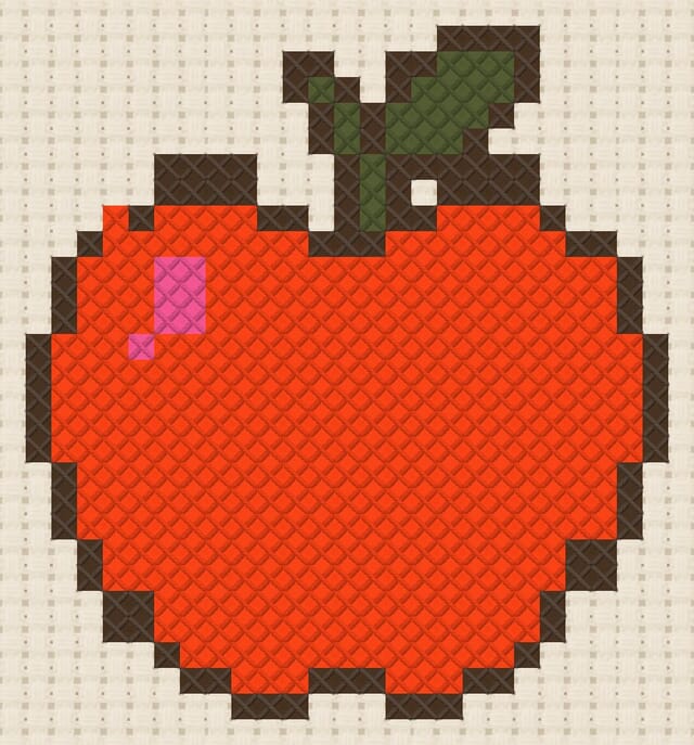 Apple finished in cross stitch on Aida cloth