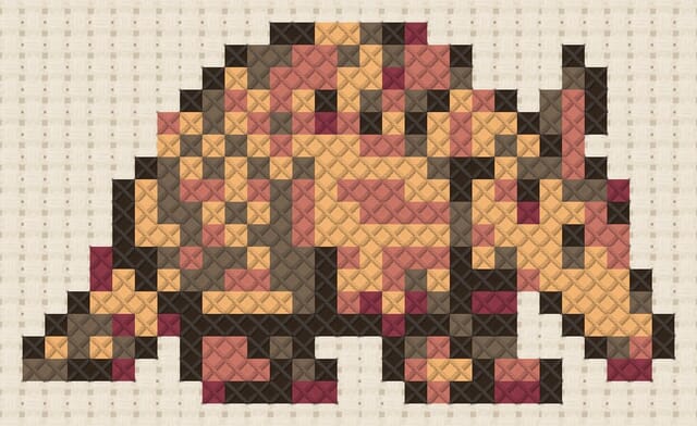 Armadillo finished in cross stitch on Aida cloth