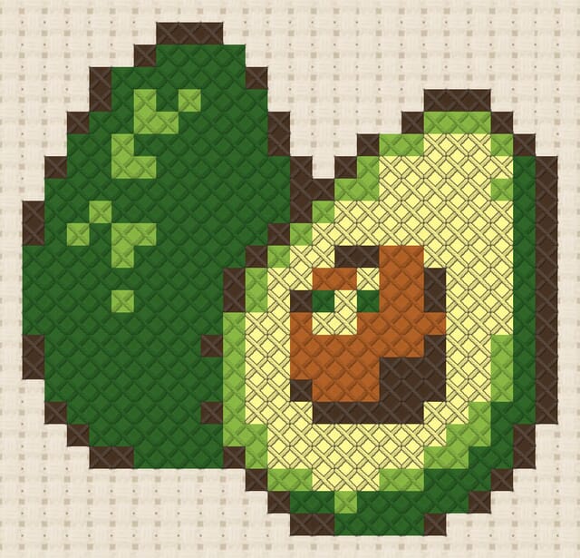 Avocado finished in cross stitch on Aida cloth