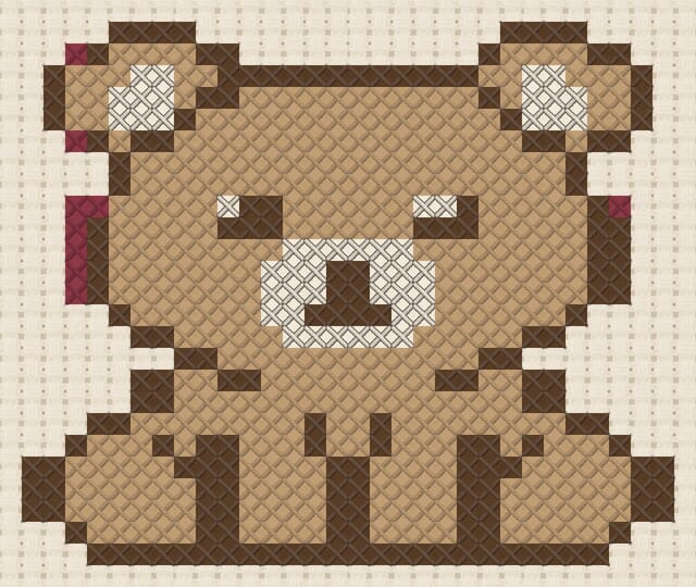 Bear cub finished in cross stitch on Aida cloth