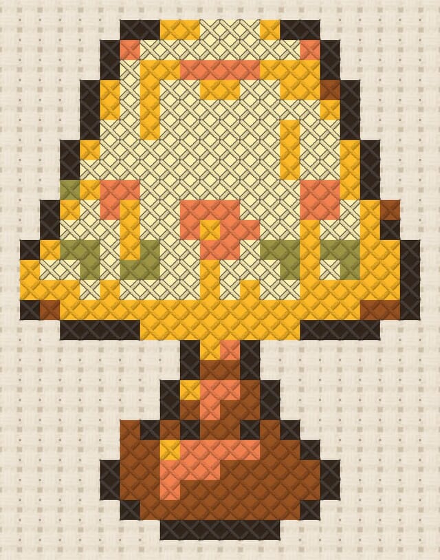 Bedside lamp finished in cross stitch on Aida cloth