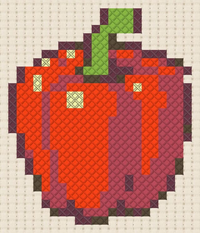 Bell pepper finished in cross stitch on Aida cloth