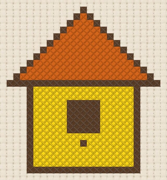 Birdhouse finished in cross stitch on Aida cloth