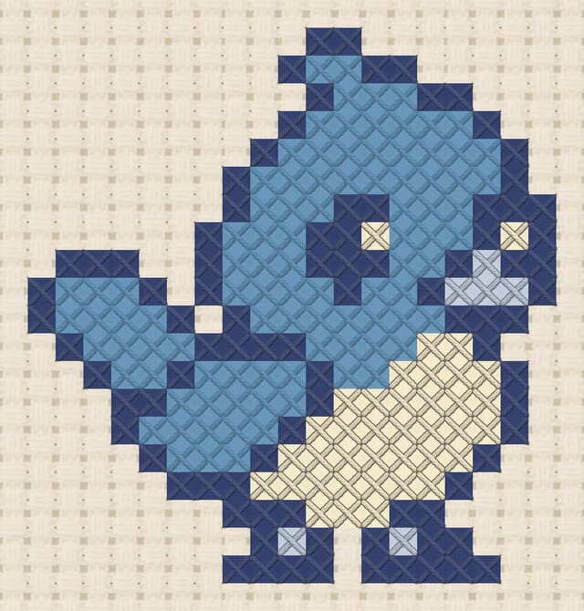 Bluebird finished in cross stitch on Aida cloth