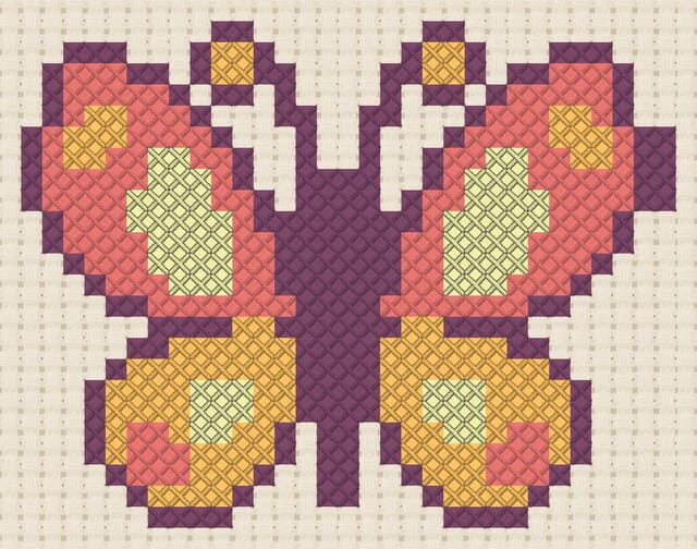 Butterfly finished in cross stitch on Aida cloth