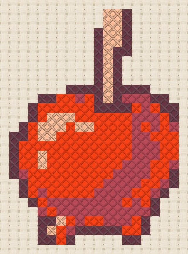 Candy apple finished in cross stitch on Aida cloth
