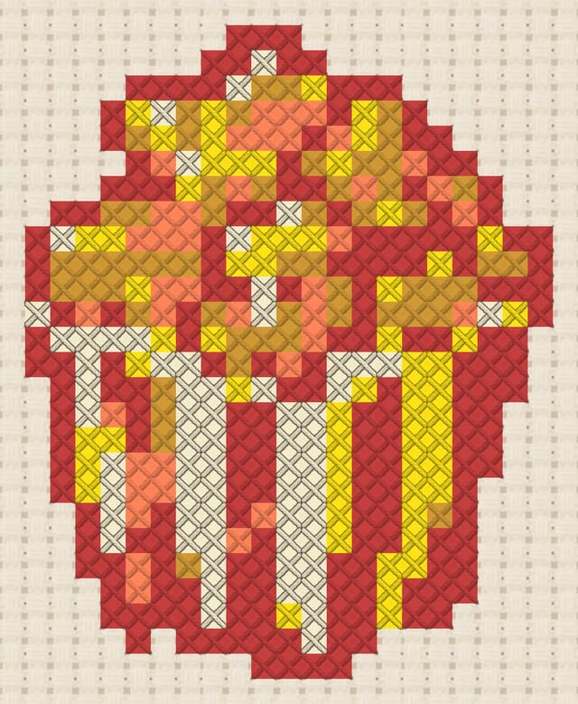 Caramel popcorn finished in cross stitch on Aida cloth
