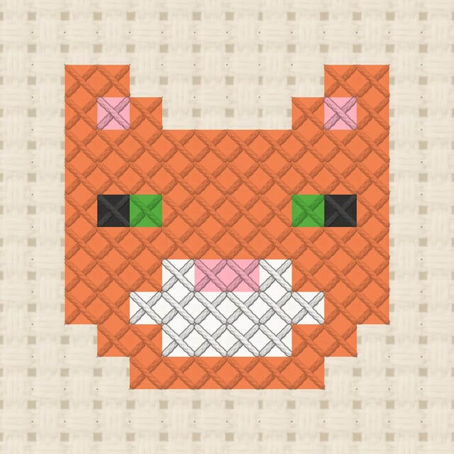 Ginger cat finished in cross stitch on Aida cloth