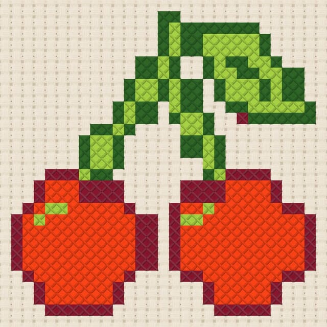 Cherries finished in cross stitch on Aida cloth