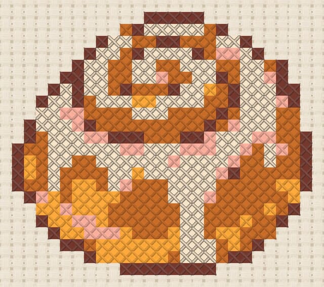 Cinnamon roll finished in cross stitch on Aida cloth