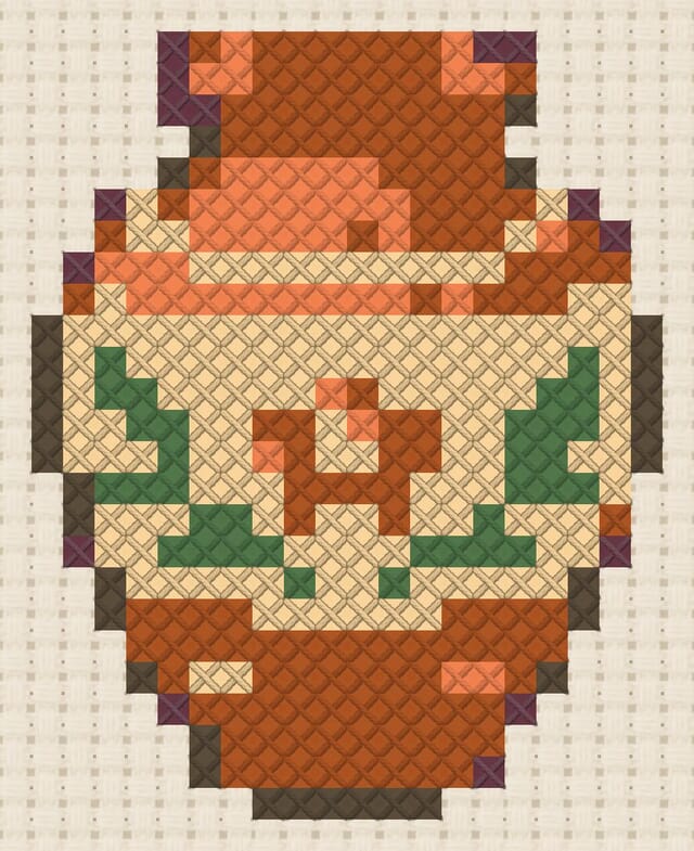 Clay vase finished in cross stitch on Aida cloth