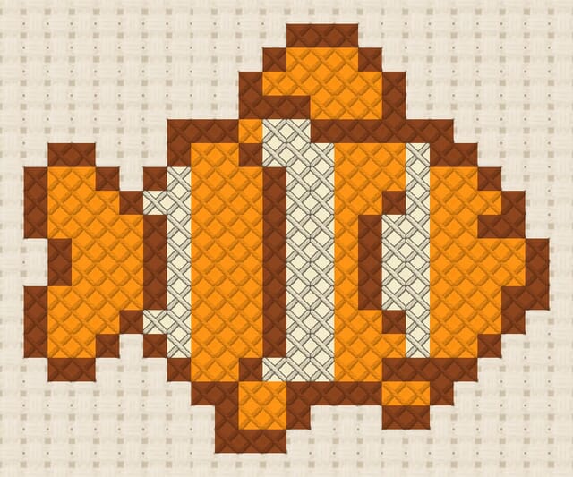 Clownfish finished in cross stitch on Aida cloth