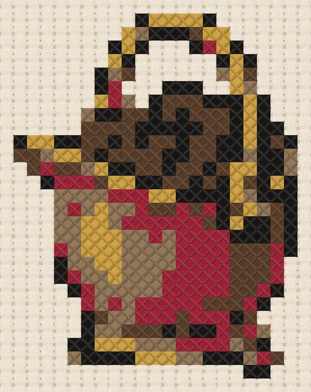 Coal scuttle finished in cross stitch on Aida cloth