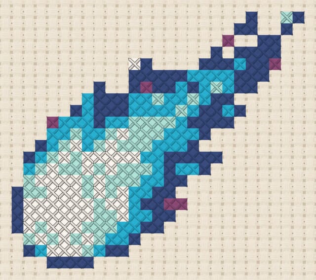 Comet finished in cross stitch on Aida cloth