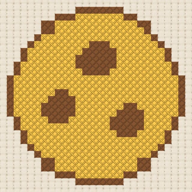 Cookie finished in cross stitch on Aida cloth