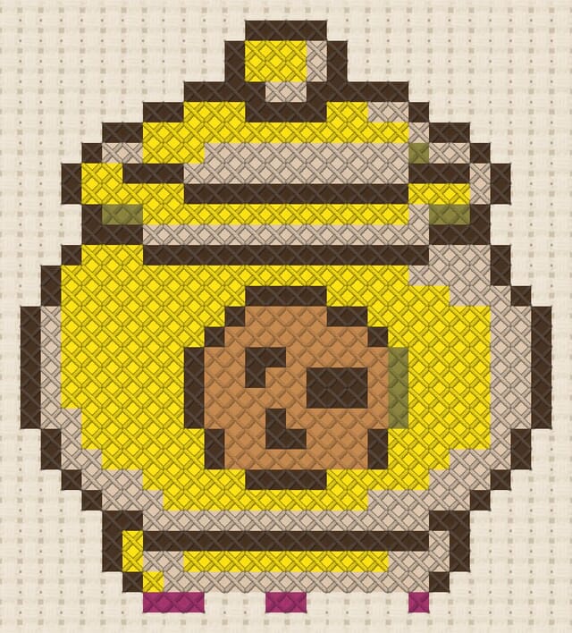 Cookie jar finished in cross stitch on Aida cloth