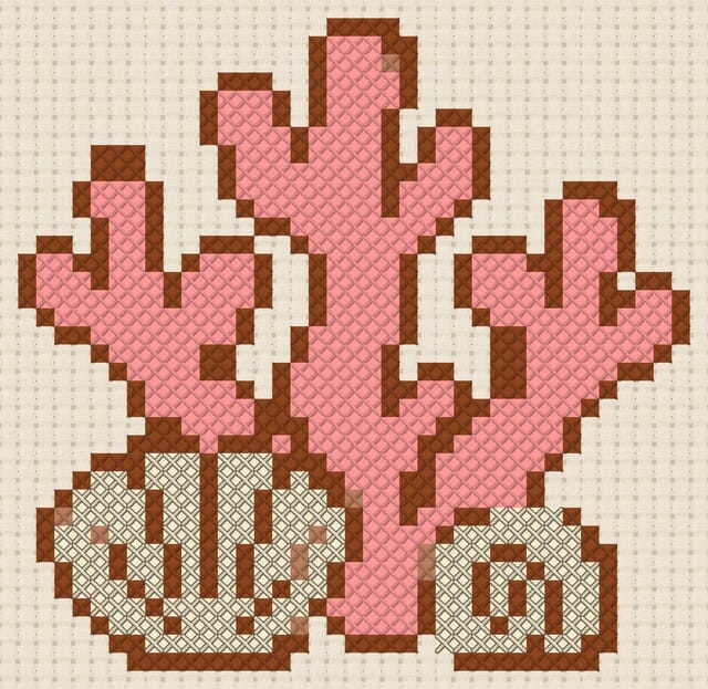 Coral and shells finished in cross stitch on Aida cloth