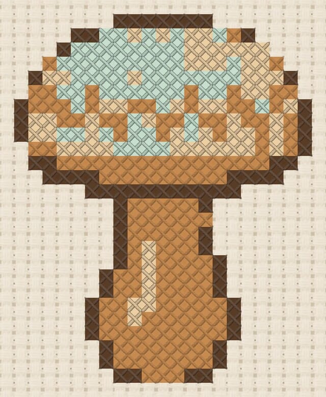 Darning mushroom finished in cross stitch on Aida cloth