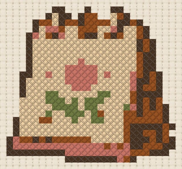 Desk calendar finished in cross stitch on Aida cloth