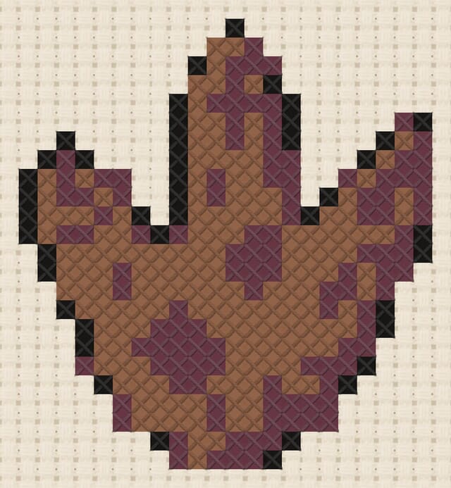 Dino footprint finished in cross stitch on Aida cloth