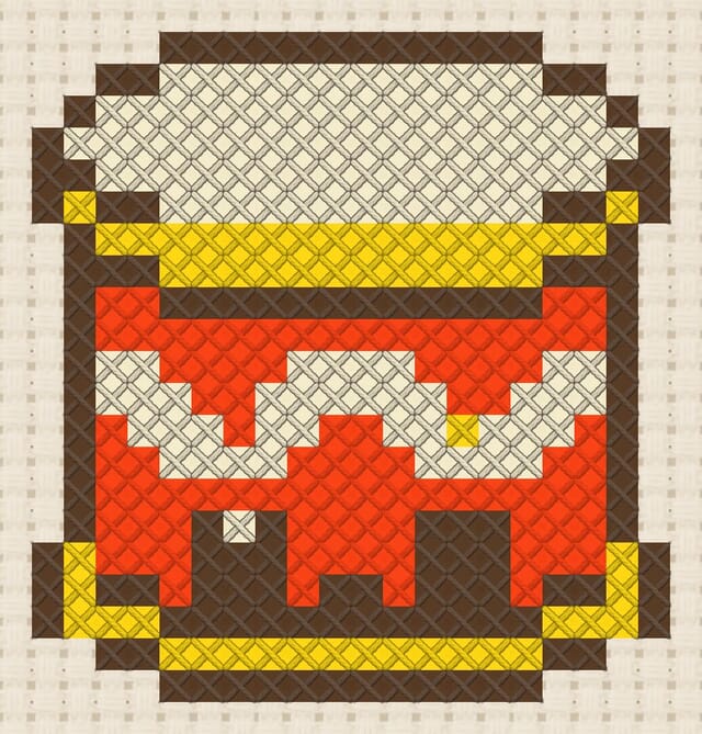 Drum finished in cross stitch on Aida cloth