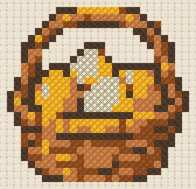 Egg basket finished in cross stitch on Aida cloth