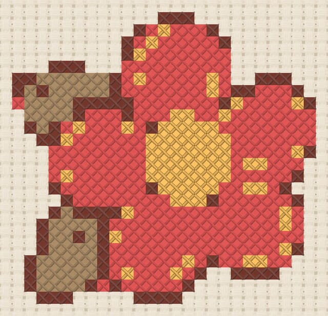 Felt flower finished in cross stitch on Aida cloth