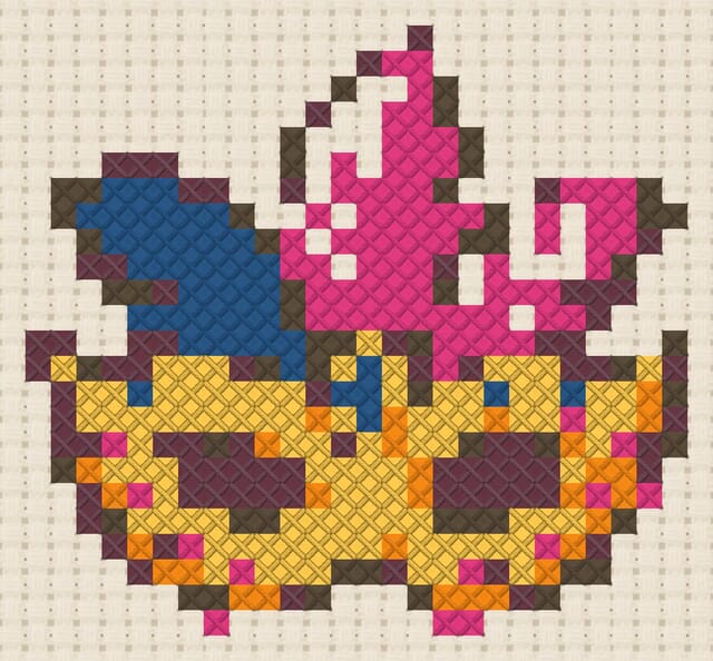 Festival mask finished in cross stitch on Aida cloth