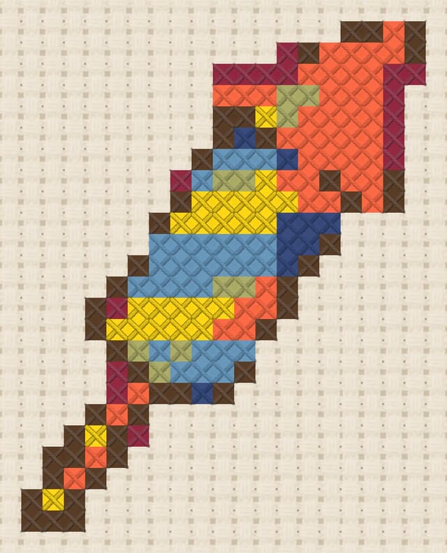 Firework rocket finished in cross stitch on Aida cloth