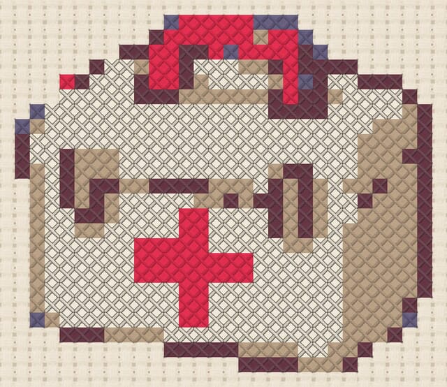 First-aid kit finished in cross stitch on Aida cloth