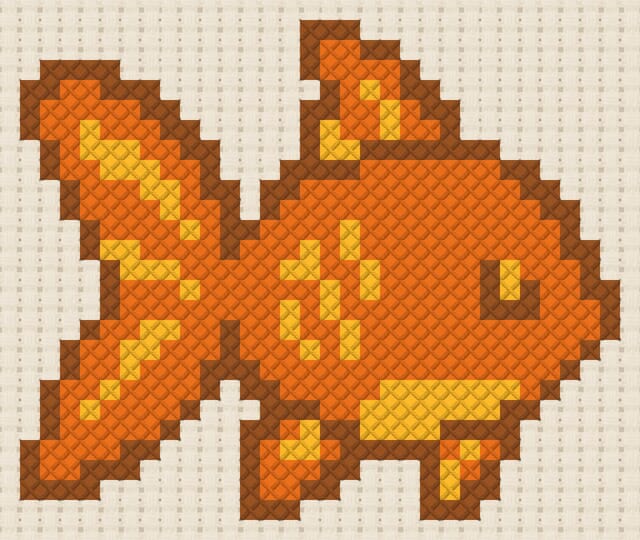 Fish finished in cross stitch on Aida cloth