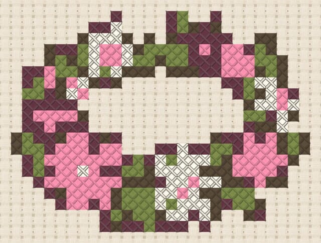 Flower crown finished in cross stitch on Aida cloth