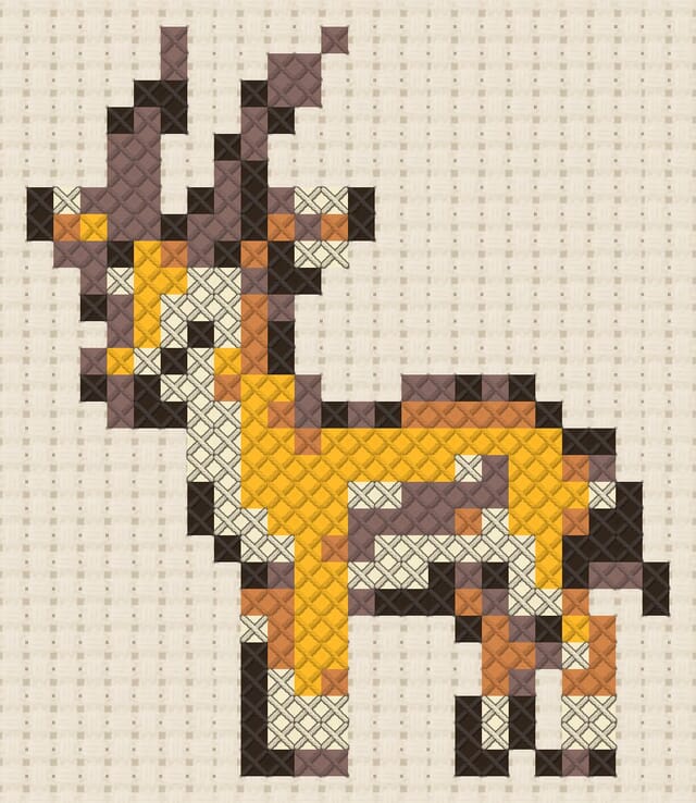 Gazelle finished in cross stitch on Aida cloth