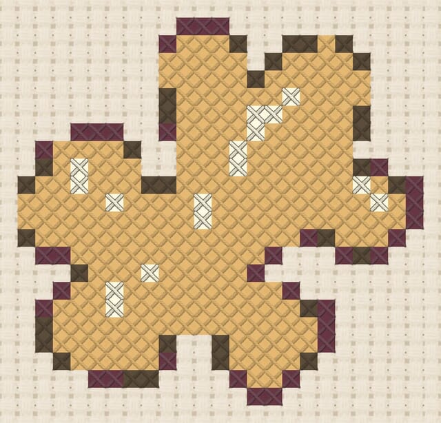Ginger root finished in cross stitch on Aida cloth