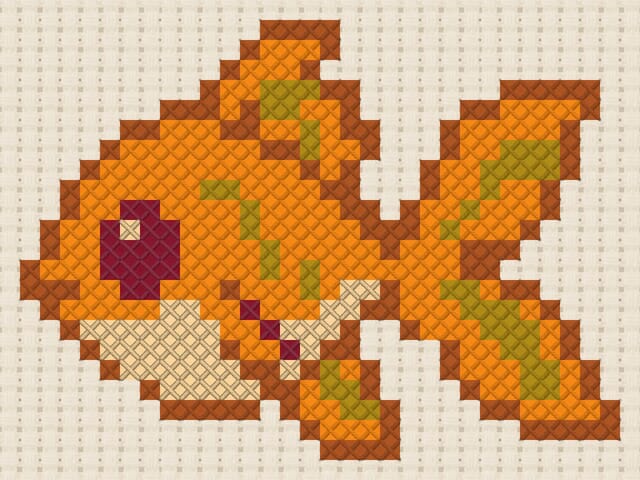 Goldfish finished in cross stitch on Aida cloth