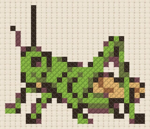 Grasshopper finished in cross stitch on Aida cloth