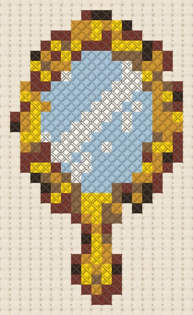 Hand mirror finished in cross stitch on Aida cloth