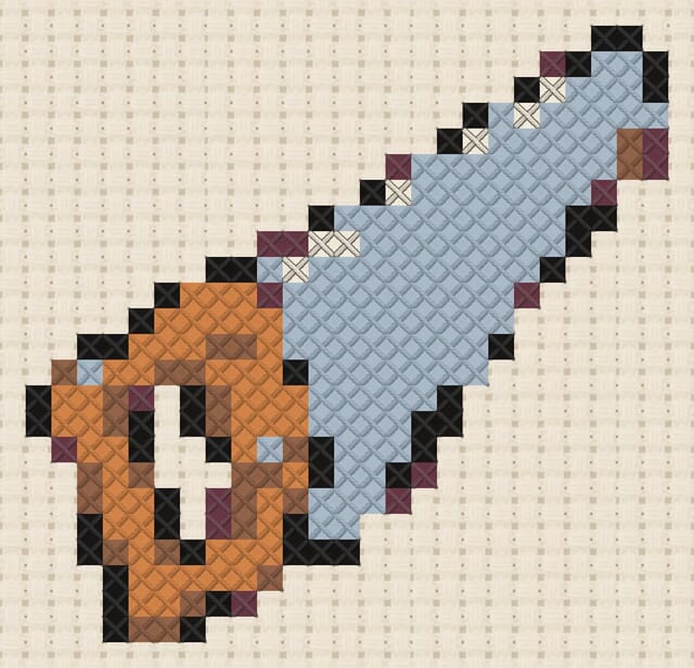 Hand saw finished in cross stitch on Aida cloth