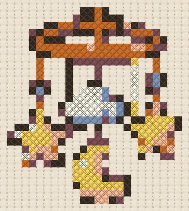 Hanging star mobile finished in cross stitch on Aida cloth