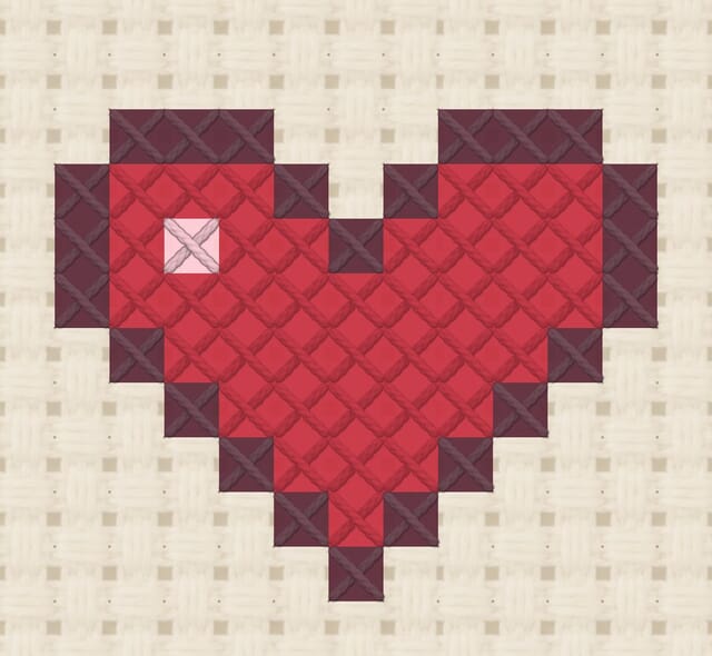 Heart finished in cross stitch on Aida cloth