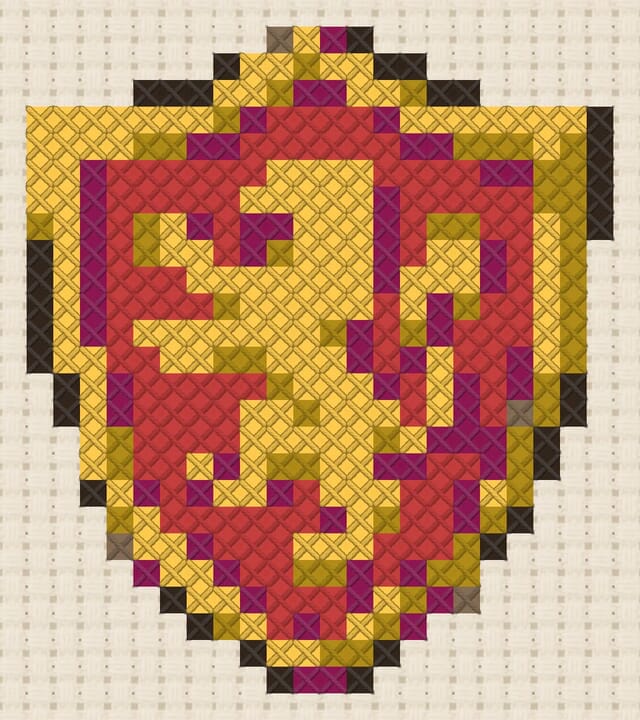 Heraldic shield finished in cross stitch on Aida cloth