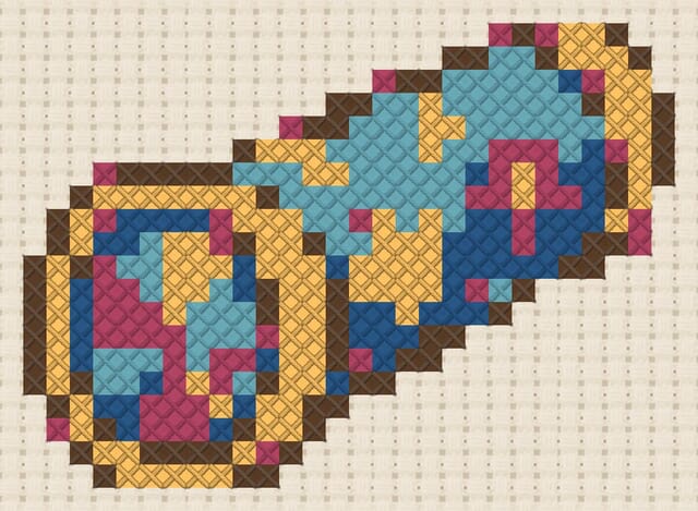 Kaleidoscope finished in cross stitch on Aida cloth