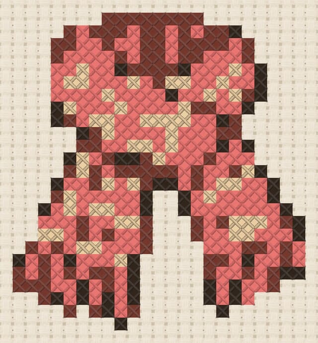 Knitted scarf finished in cross stitch on Aida cloth