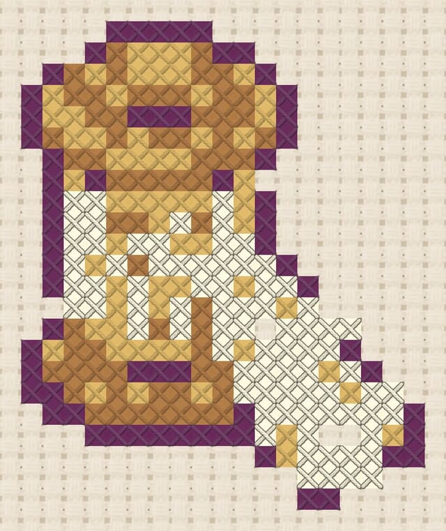 Lace bobbin finished in cross stitch on Aida cloth