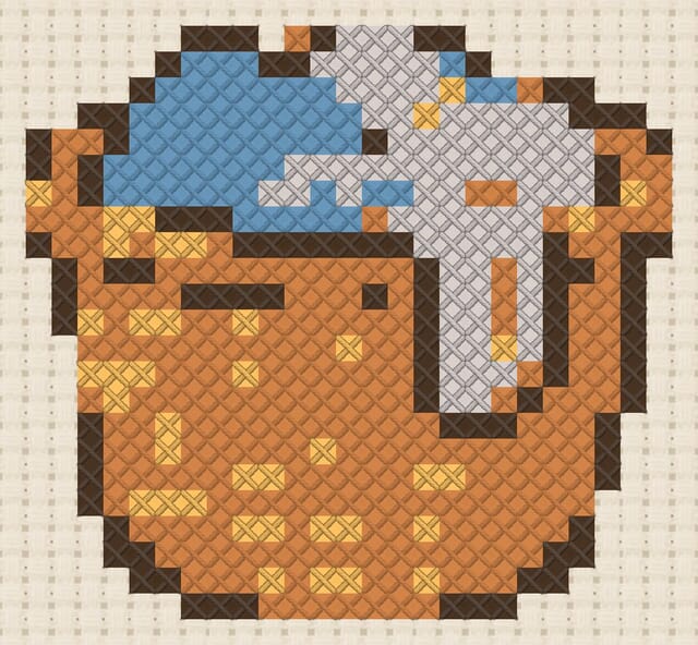 Laundry basket finished in cross stitch on Aida cloth