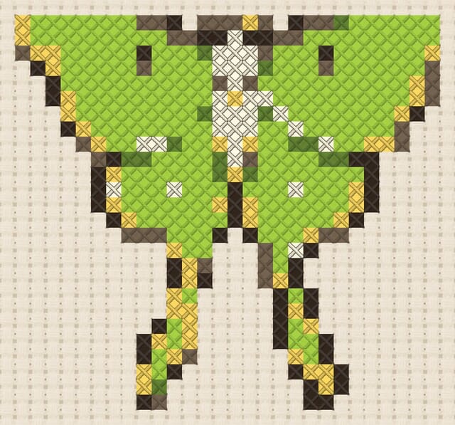 Luna moth finished in cross stitch on Aida cloth