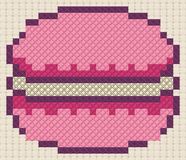 Macaron finished in cross stitch on Aida cloth