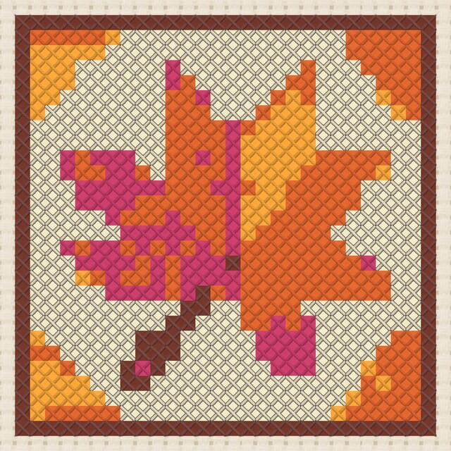 Maple leaf quilt block finished in cross stitch on Aida cloth