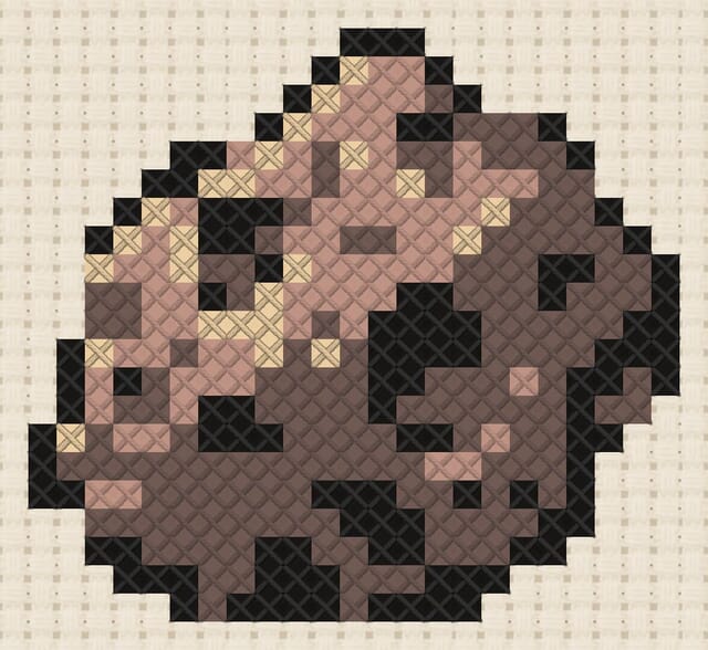 Meteorite finished in cross stitch on Aida cloth