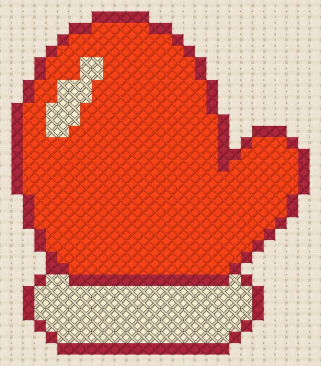 Mitten finished in cross stitch on Aida cloth
